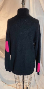 Tricot col roulé noir à pois rose