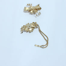 Ensemble broche et bracelet doré avec pierres mauves et blanches