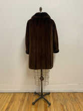 Manteau de fourrure mi-long