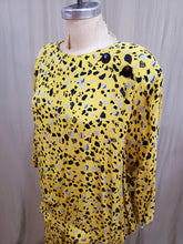 Chandail jaune à motifs géométrique