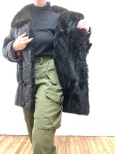 Manteau mi-long en cuir et fourrure