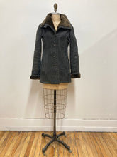 Manteau de cuir et fourrure